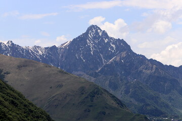 Snow-covered mountain peaks of the Main Caucasian Range. Landscape in the mountains of Georgia.