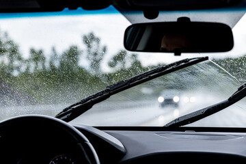 Driving in the rain on highway - obrazy, fototapety, plakaty