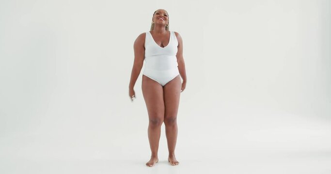 cool sexy plump African girl enjoying party at studio, slow motion. afro overweight hot woman gets pleasure from dancing, chubby lady in bodysuit spending great time