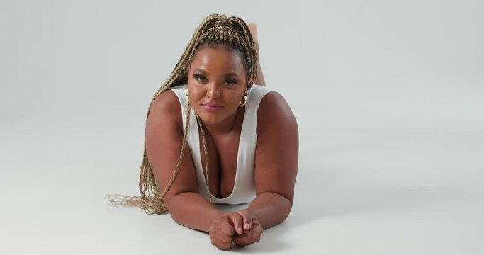 smiling happy African girl stetching her spine body like cat , yoga fitness. Upward facing dog Freedom, health Slow motion