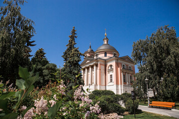 Moscow, Russia: The Temple of the Great Martyr Varvara on Varvarka Street near Red Square on a sunny summer day. View of the temple from Zaryadye Park.
