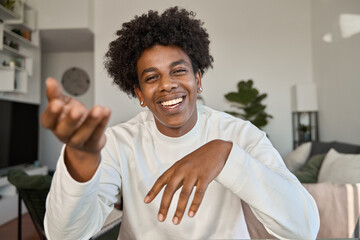 Happy African American gen z teen talking to web cam recording tutorial, learning english online on virtual class or having elearning hybrid video call as student, shooting vlog as blogger influencer.