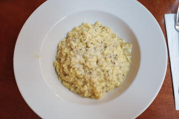 Top view Risotto with Truffle on wooden table. 