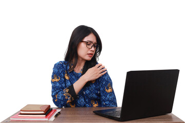 Asian female in batik korpri, indonesian traditional uniform having shoulder pain while working