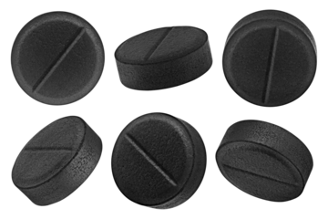activated Charcoal Pills, isolated on white background, full depth of field