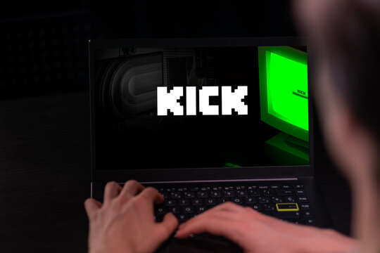 Málaga,Spain. 11 of June 2023. Hands of a person using a computer streaming on Kick. Kick will pay $16 per hour.Concept of streamer