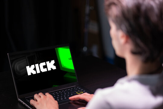 Málaga,Spain. 11 of June 2023. Hands of a person using a computer streaming on Kick. Kick will pay $16 per hour.Concept of streamer