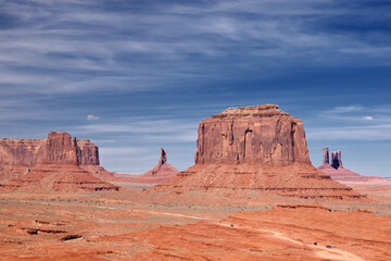 Fototapeta premium Amazing red rock formations in the Monument Valley, Navajo Tribal Park, Utah, USA. Dry dessert landscape