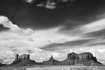 Obraz premium Amazing rock formations in the Monument Valley, Navajo Tribal Park, Utah, USA. Dry landscape. Black and white photography.
