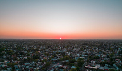 Fototapeta na wymiar reddish sun setting on the horizon at sunset