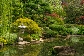 Fototapeta na wymiar Japanese garden with stone sculpture 