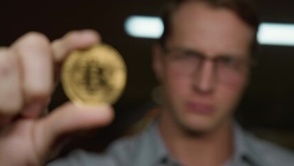Entrepreneur looks intently at bitcoin