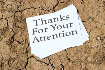 Thank you for your attention concept on papers on dry cracked ground drought background