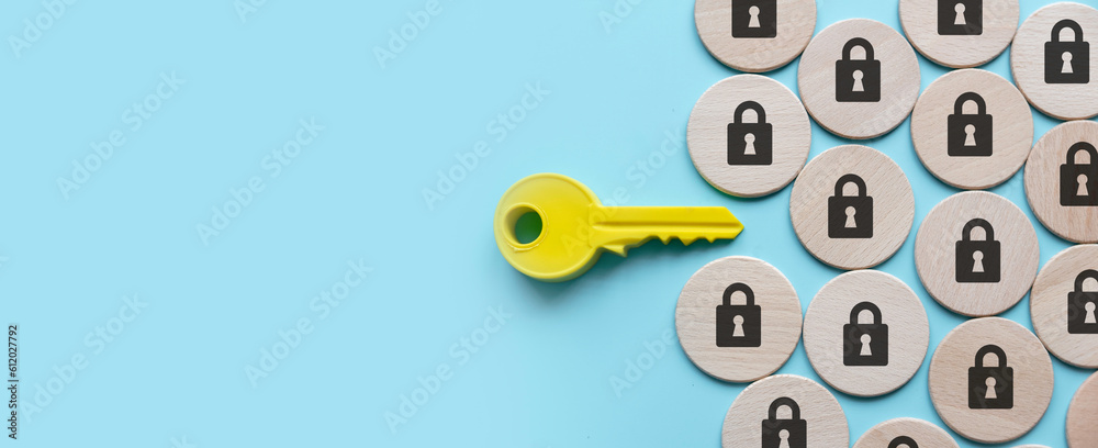 Wall mural security and protection concept. a yellow key among a padlock symbol. - Wall murals