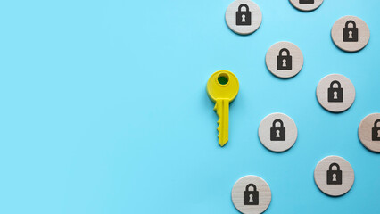 Security and protection concept. A yellow key among a padlock symbol. Copy space.