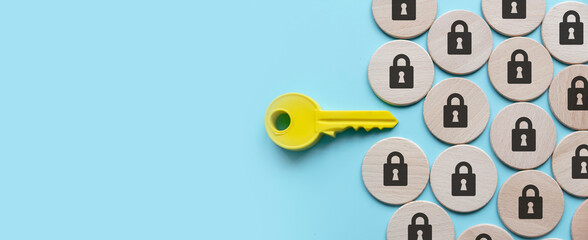 Security and protection concept. A yellow key among a padlock symbol.