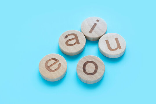 Learning english concept.Vowels of AEIOU on a blue background.
