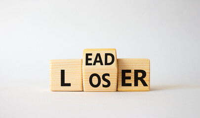 Leader vs Loser symbol. Wooden cubes with words Loser and Leader. Beautiful white background. Leader vs Loser and business concept. Copy space