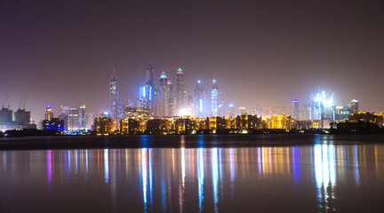 Fototapeta na wymiar Dubai, UAE. Beautiful night view at Dubai Marina from the Palm Jumeirah at night.