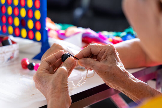 Elderly playing colorful beads living alone toys for educational anti-dementia suitable or alzheimer's disease for elderly to play exercise hand and brain.