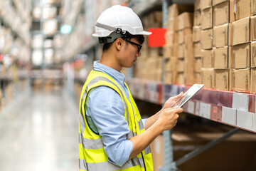 Portrait engineer worker labor man shipping transportation ship loading move inventory cardboard boxes in factory distributions warehouse at logistics center.logistic industry, business import export © Art_Photo