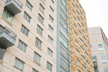 modern structures, with their expansive windows, stand tall beside the weathered beauty of older buildings, symbolizing the intersection of tradition and progress