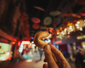 hands with a Chinese cookie