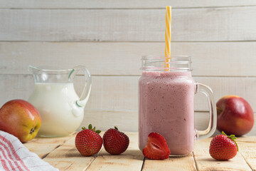 Fresh milkshake with strawberries. A glass of fresh strawberry milkshake