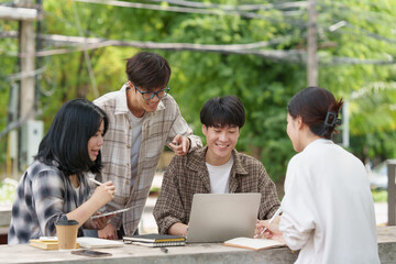 Beautiful young Asian people college student with friends at outdoors. College student working on the college campus.