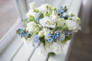 Wedding bouquet for the bride. White and blue flowers