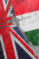 Illustration of cracked between United Kingdom and Hungarian flags, concept of global crisis in political and economic relations