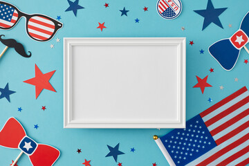 Party concept for celebrating 4th of July. Top view flat lay of national flag, paper accessories, star-shaped confetti on pastel blue background with blank frame for text or message