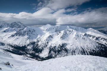 Fototapeta premium Tatras snow-covered peaks and serene valleys