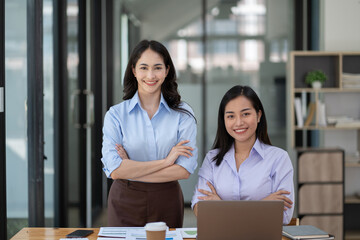 Businesswoman working with female colleagues inside the office.