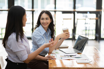 Businesswoman working with female colleagues inside the office