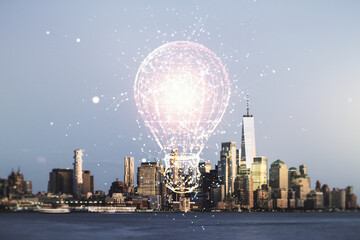 Abstract virtual light bulb hologram on Manhattan cityscape background, idea concept. Multiexposure