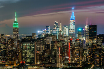 Aerial view midtown New York City at Night Empire State Building One Vandebilt Chrysler building 
