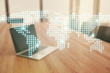 Abstract creative world map with connections on modern laptop background, international trading concept. Multiexposure