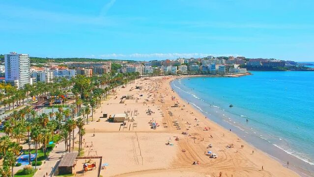 Beach in Catalan city Salou, Spain, Europe. Sea and palm in Catalonia