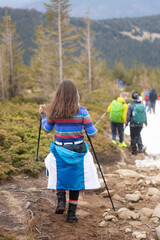 
tourists come down the mountain