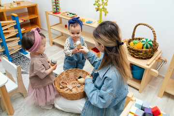Mother holding basket of first wooden montessori toys