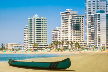 Beach lengthwise Salinas. Ecuador. Beach in the city of Salinas. The embankment and the beach in Ecuador.  Vacation on the Pacific Ocean.