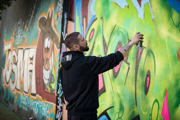 view of an artist doing street art in Paris