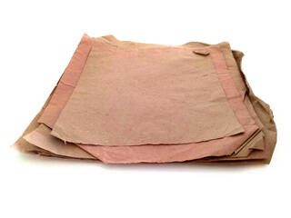 Perspective of Bunch of recycled papers of various sizes and colors isolated. Pieces of packing paper on white background. Card boards and crafts concept.