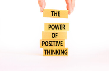 Positive thinking symbol. Concept words The power of positive thinking on wooden block. Beautiful white background. Businessman hand. Business, motivational positive thinking concept. Copy space.