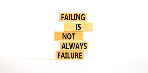 Failure or failing symbol. Concept words Failing is not always failure on wooden block. Beautiful white table white background. Business, failure or failing concept. Copy space.