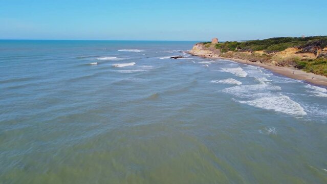Tor di Caldano old tower in Anzio, near Rome, Italy. Beach and sea