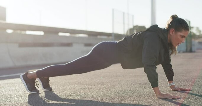 Fitness, push ups or girl in city training or exercising in workout for arms strength or healthy body. Strong woman, resilience or powerful sports athlete in exercise challenge for wellness on road