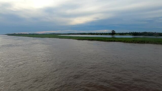 amazon river in amazon rainforest Brazil waling at sunset