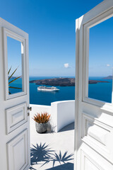 Fototapeta na wymiar White architecture in Santorini island, Greece. Beautiful terrace with sea view.